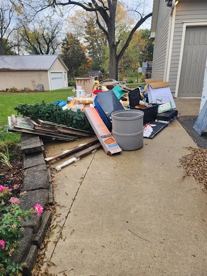 Dumpster being loaded with debris for 30 Yard Dumpster Rental in Cascades